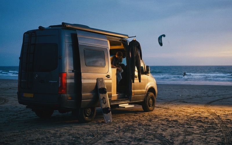 Kite trip lifestyle - riders on exotic beach